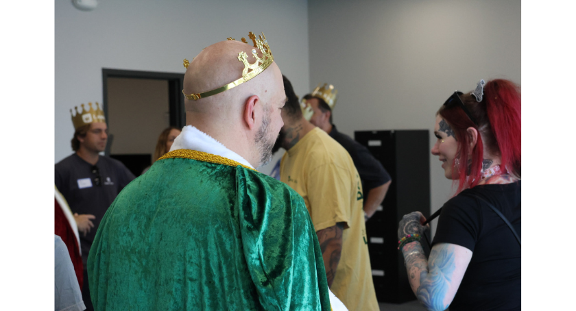 King of the Mountain, Adam Peek, speaks with a guest.